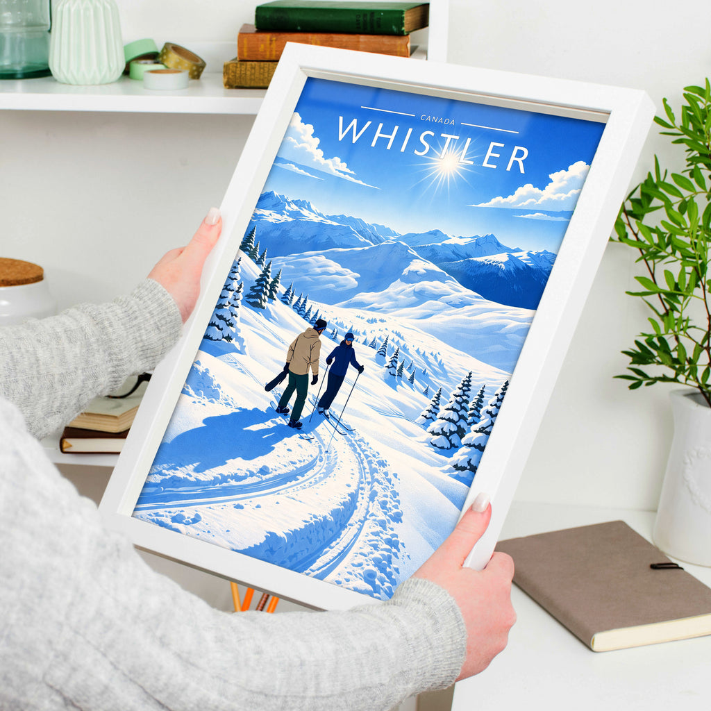 Whistler Travel Poster in a white frame, held to show scale