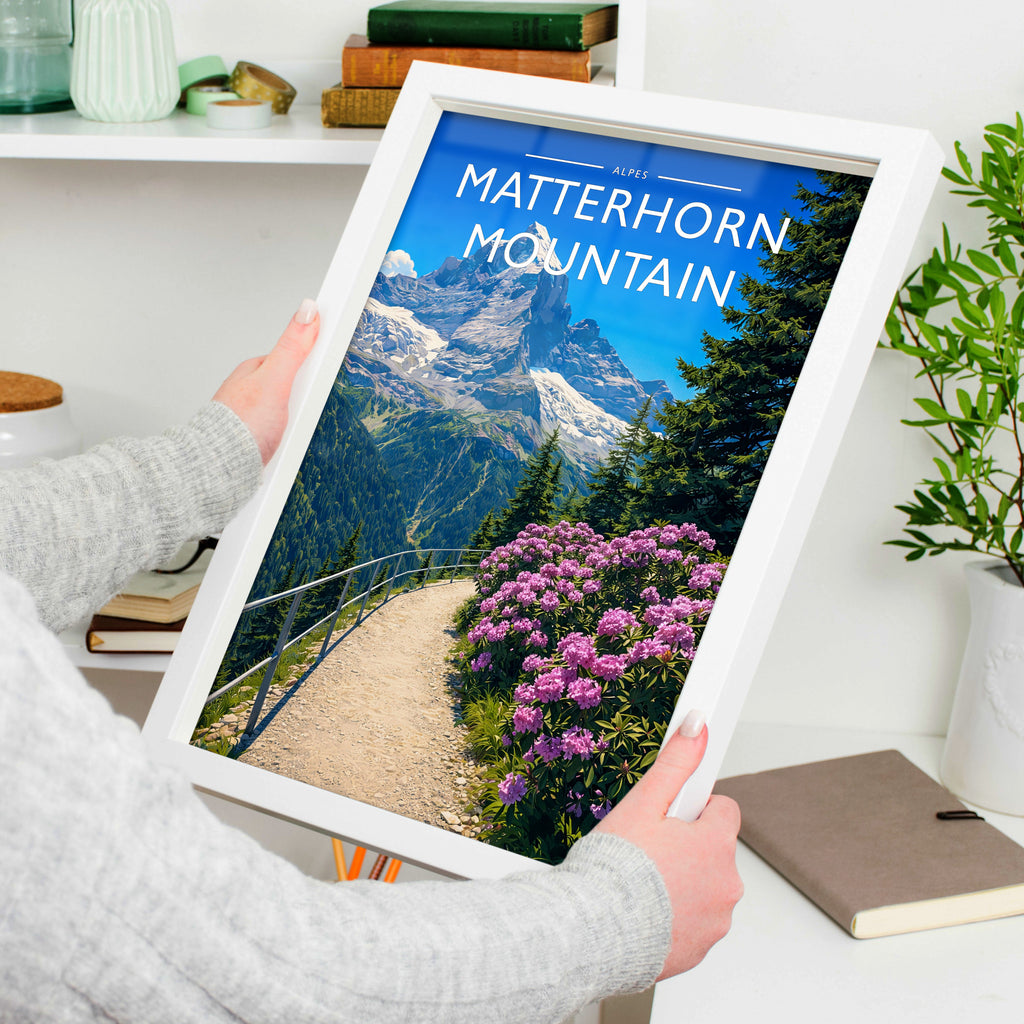 Matterhorn Mountain Travel Poster in a white frame, held to show scale