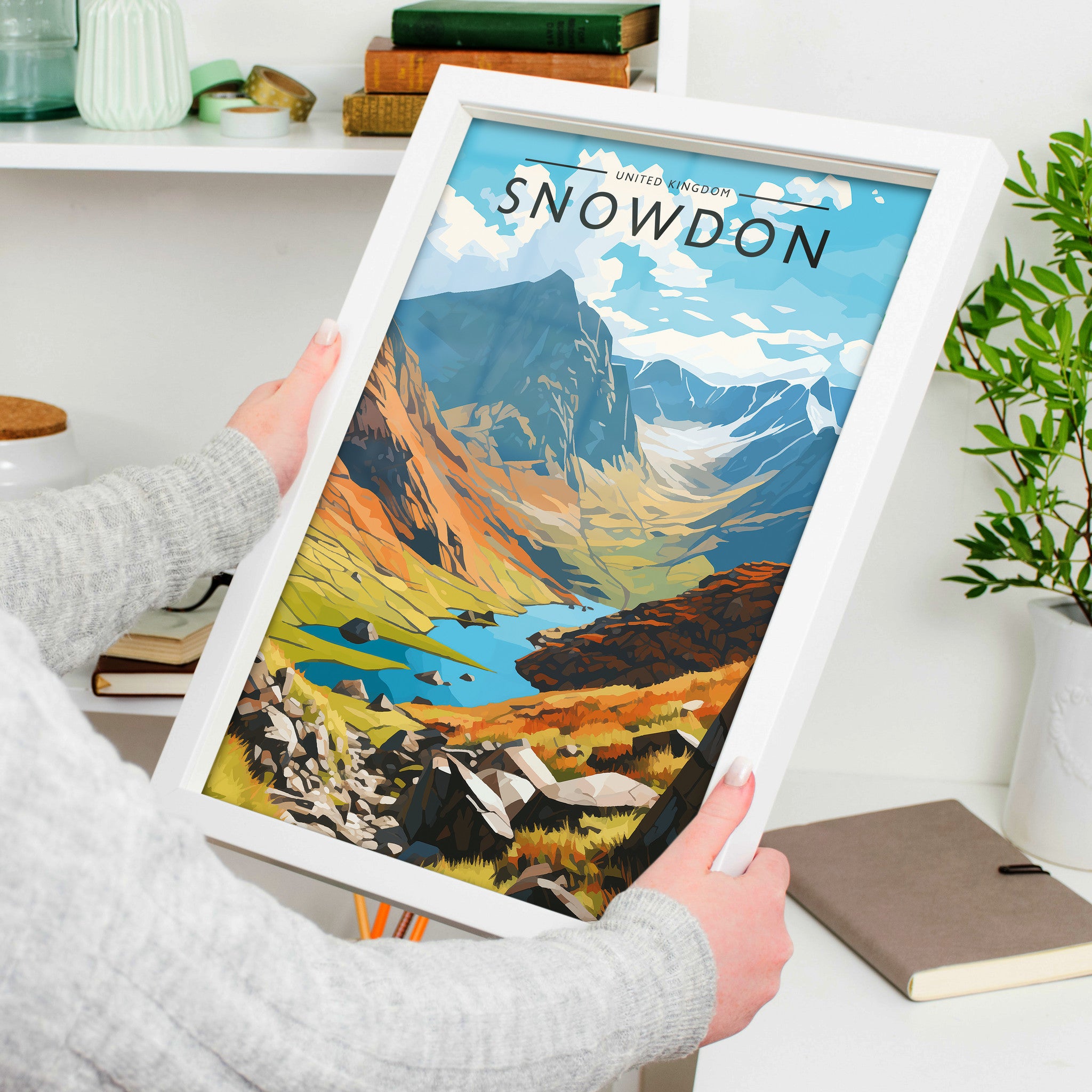 Snowdon Travel Poster in a white frame, held to show scale