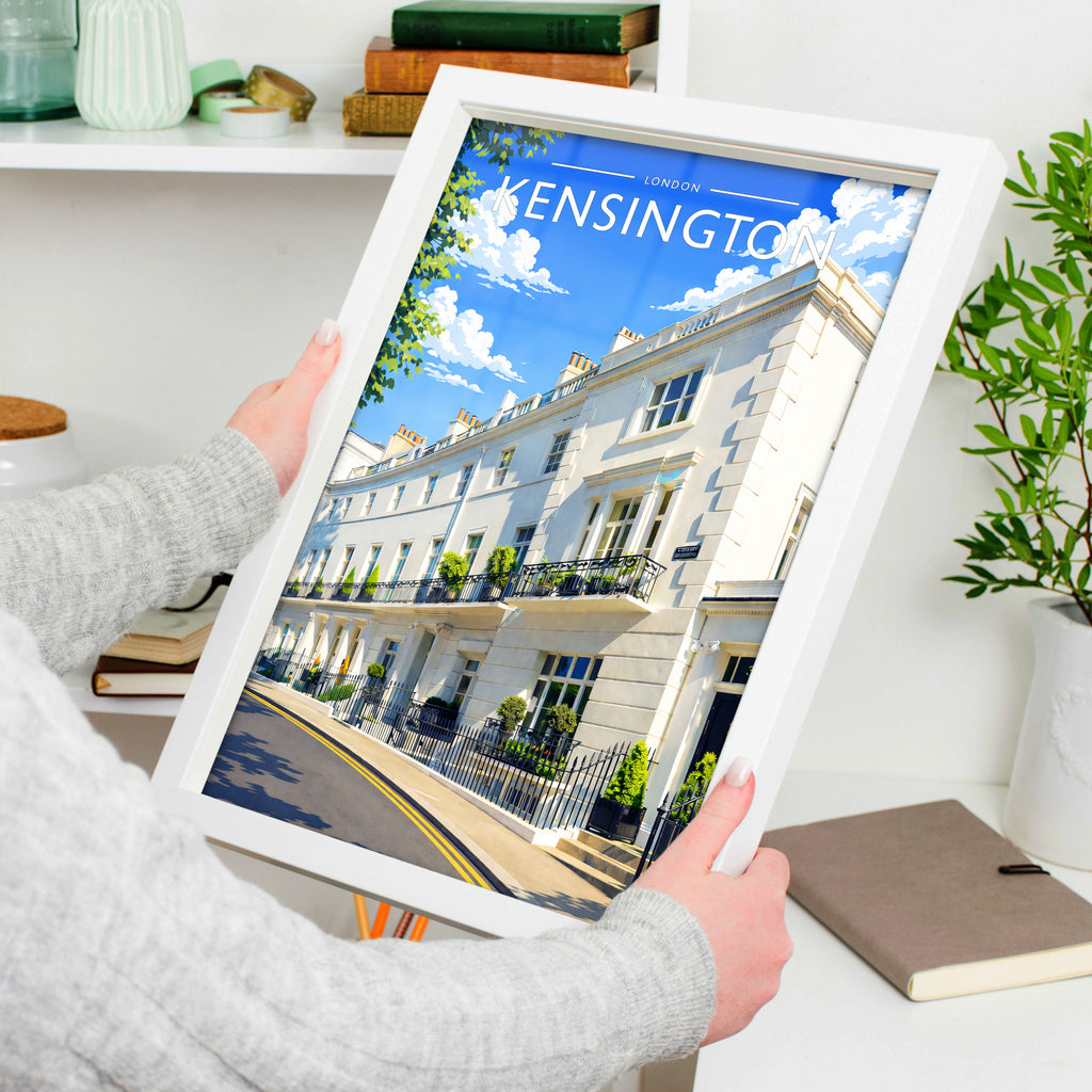 Kensington Travel Poster in a white frame, held to show scale