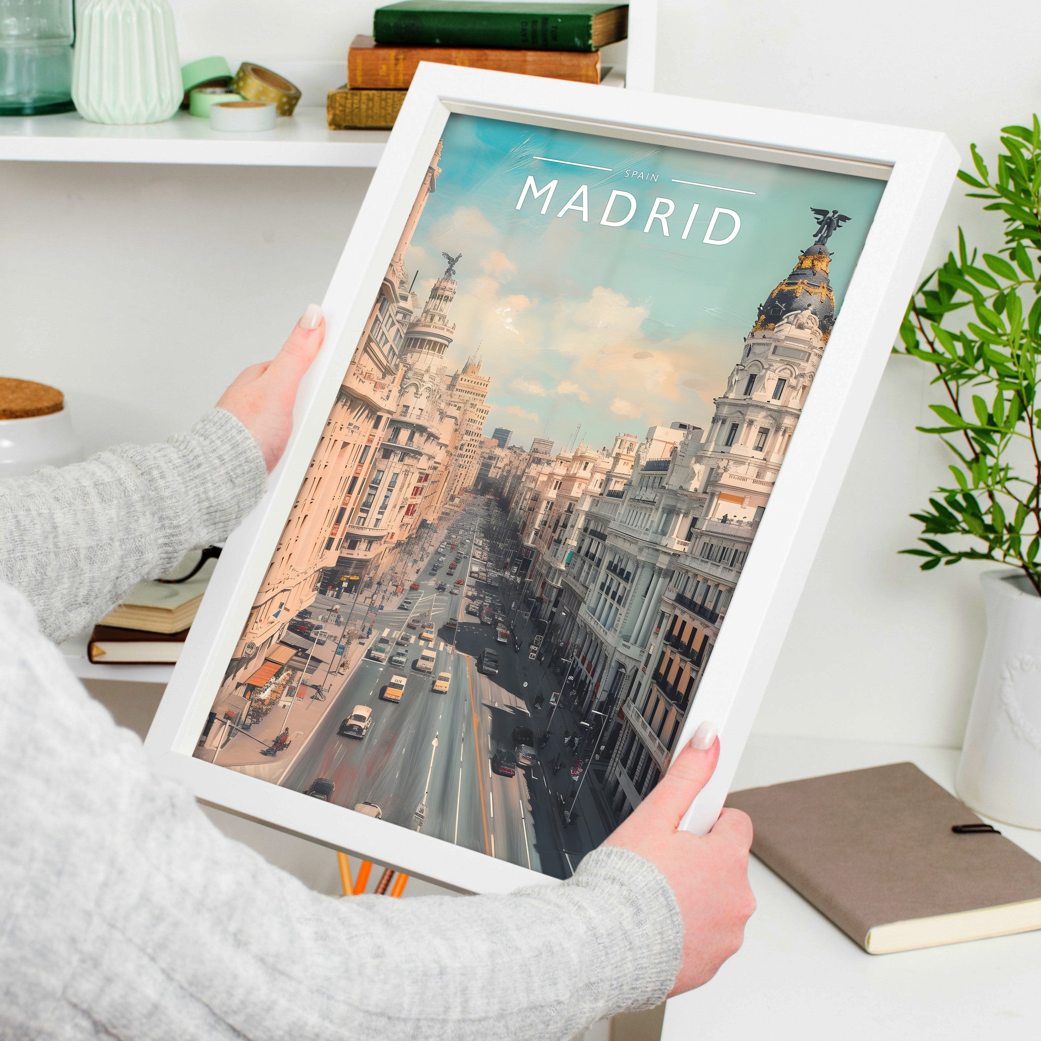 Madrid Travel Poster in a white frame, held to show scale