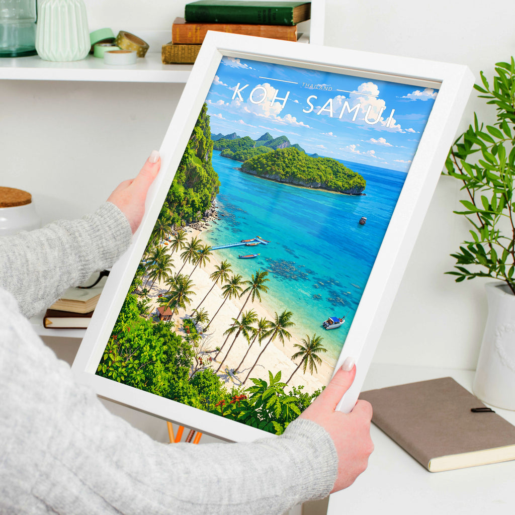 Koh Samui Travel Poster in a white frame, held to show scale