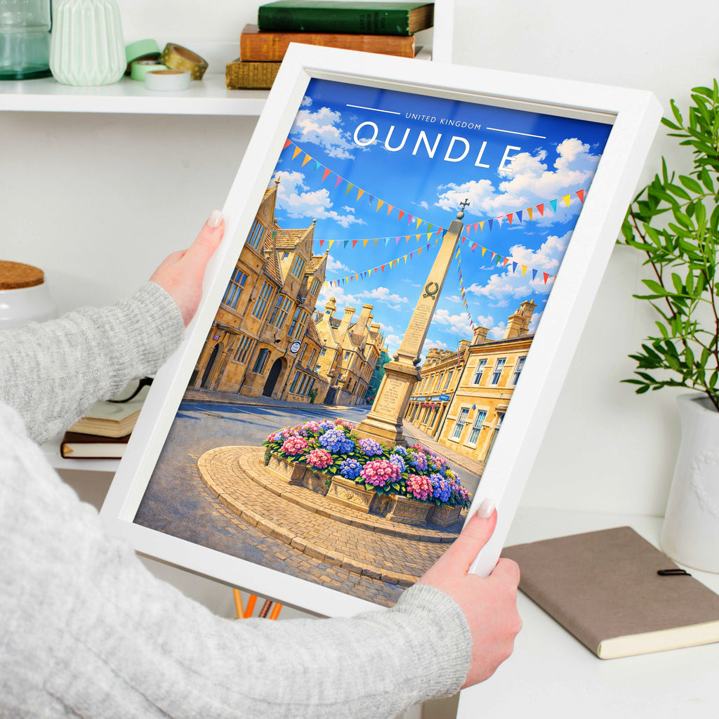 Oundle #2 Travel Poster in a white frame, held to show scale