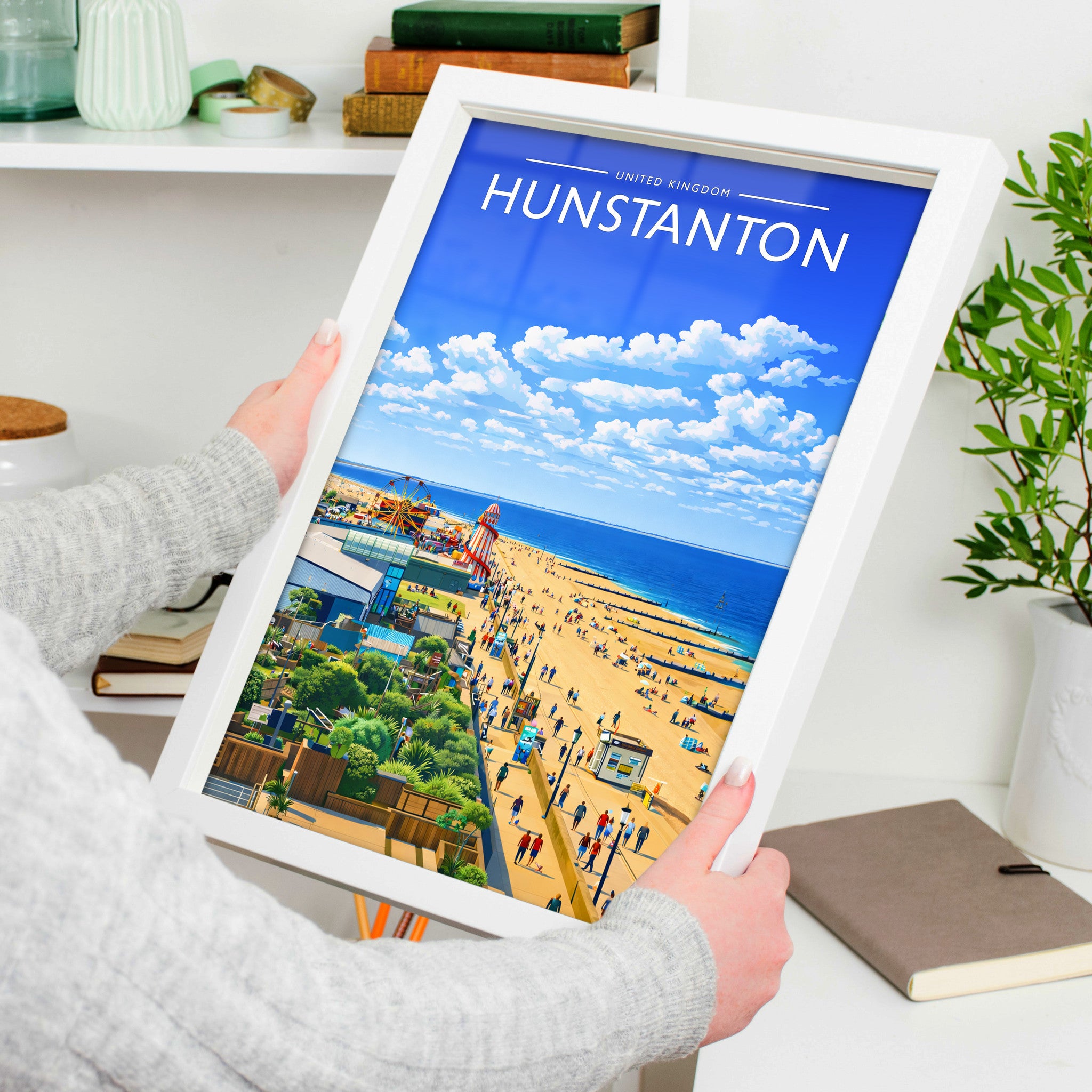 Hunstanton Travel Poster in a white frame, held to show scale