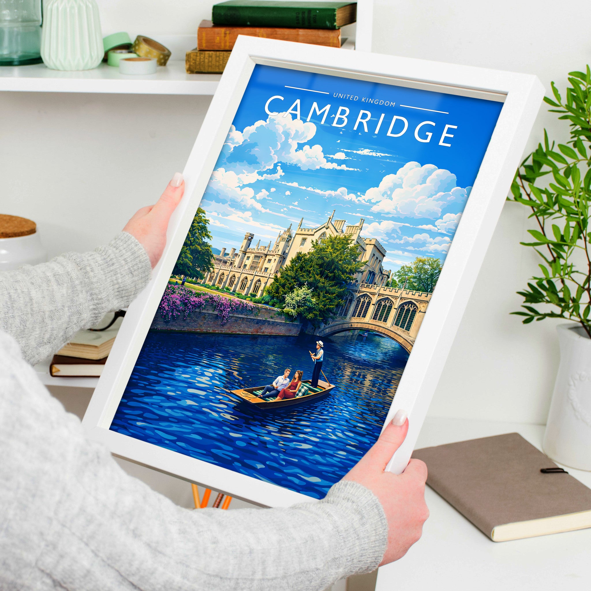 Cambridge Travel Poster in a white frame, held to show scale