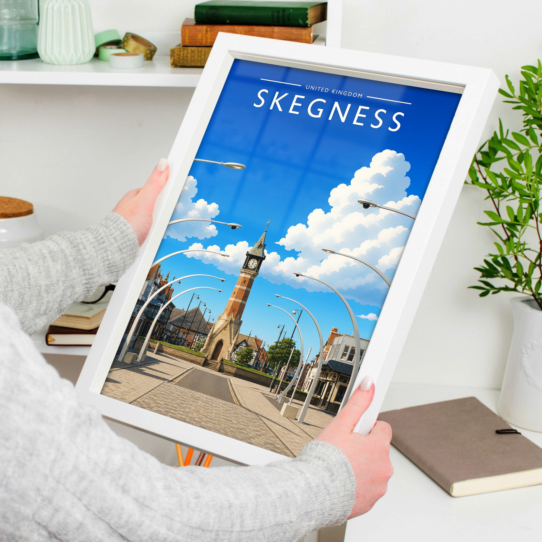 Skegness #2 Travel Poster in a white frame, held to show scale