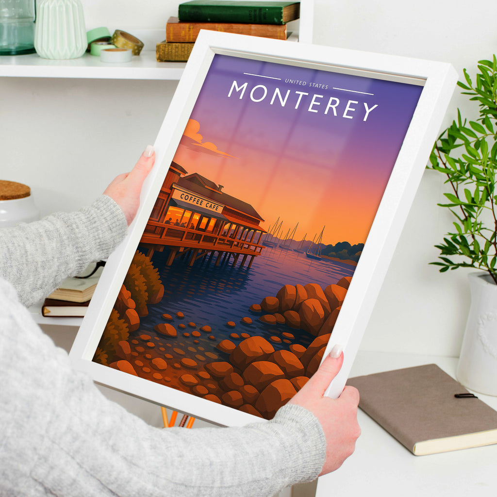 Monterey Travel Poster in a white frame, held to show scale