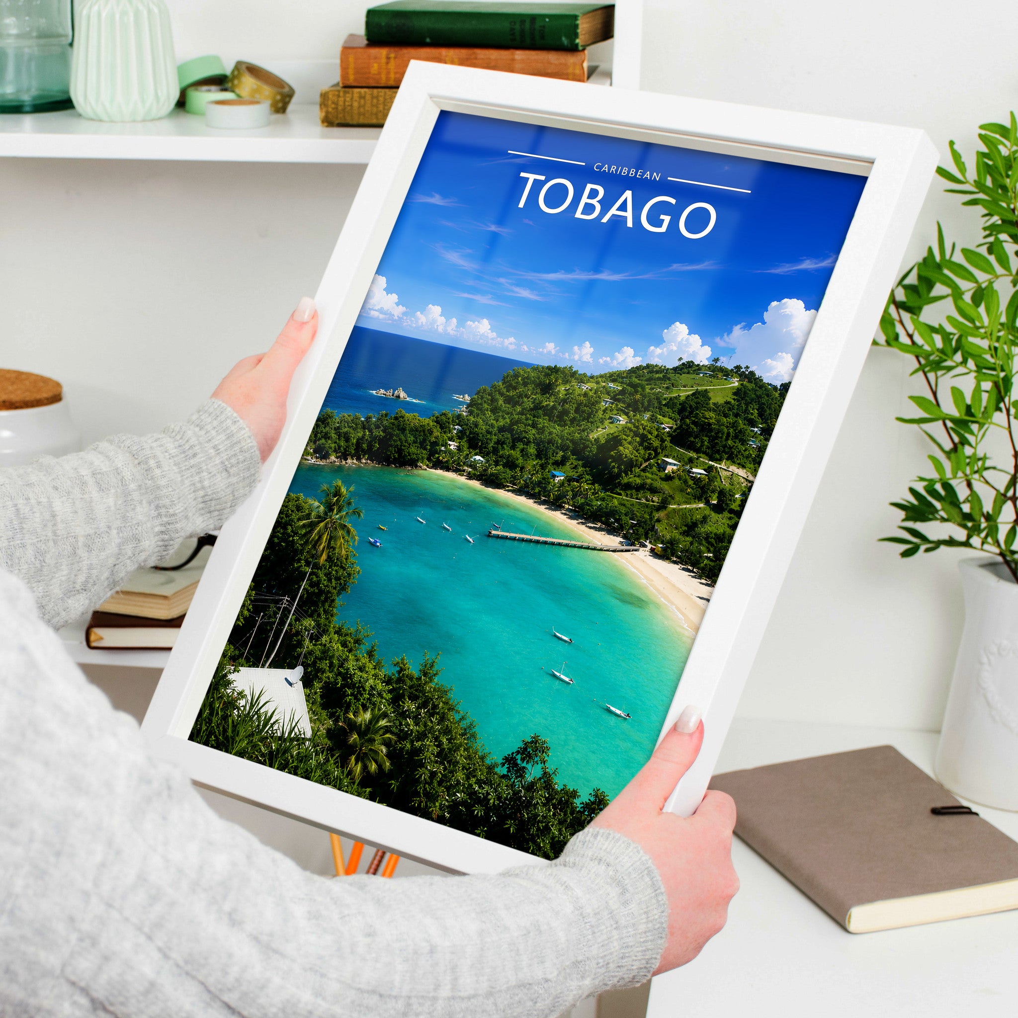 Tobago Travel Poster in a white frame, held to show scale