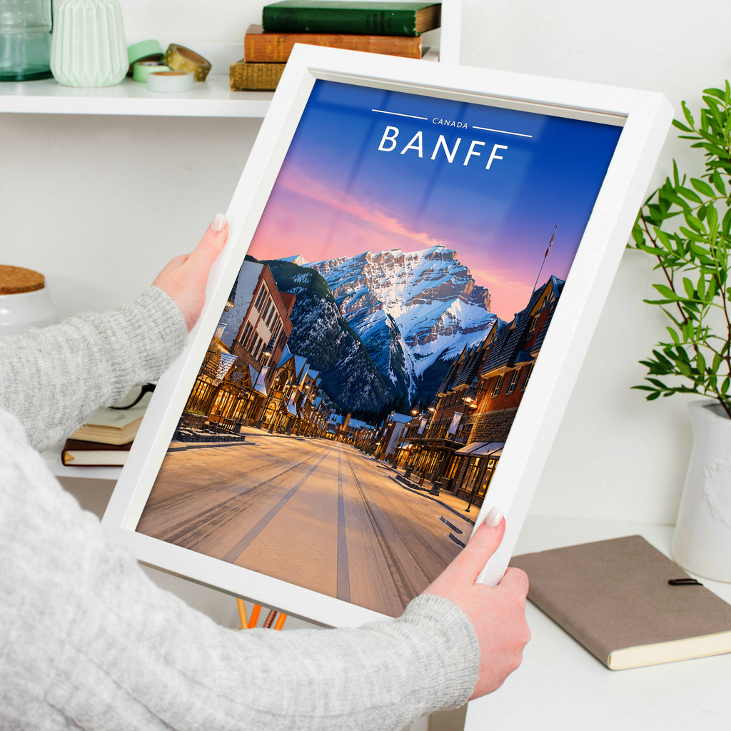 Banff Travel Poster in a white frame, held to show scale