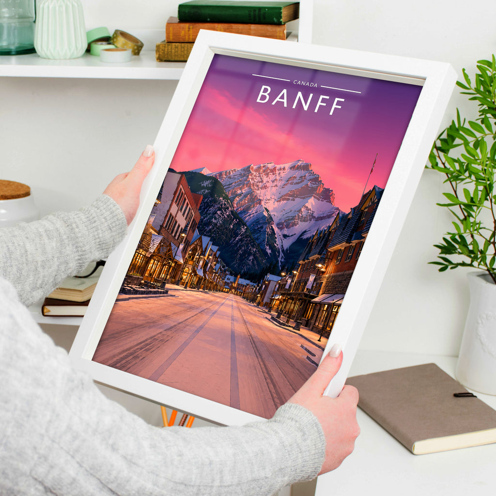 Banff #2 Travel Poster in a white frame, held to show scale