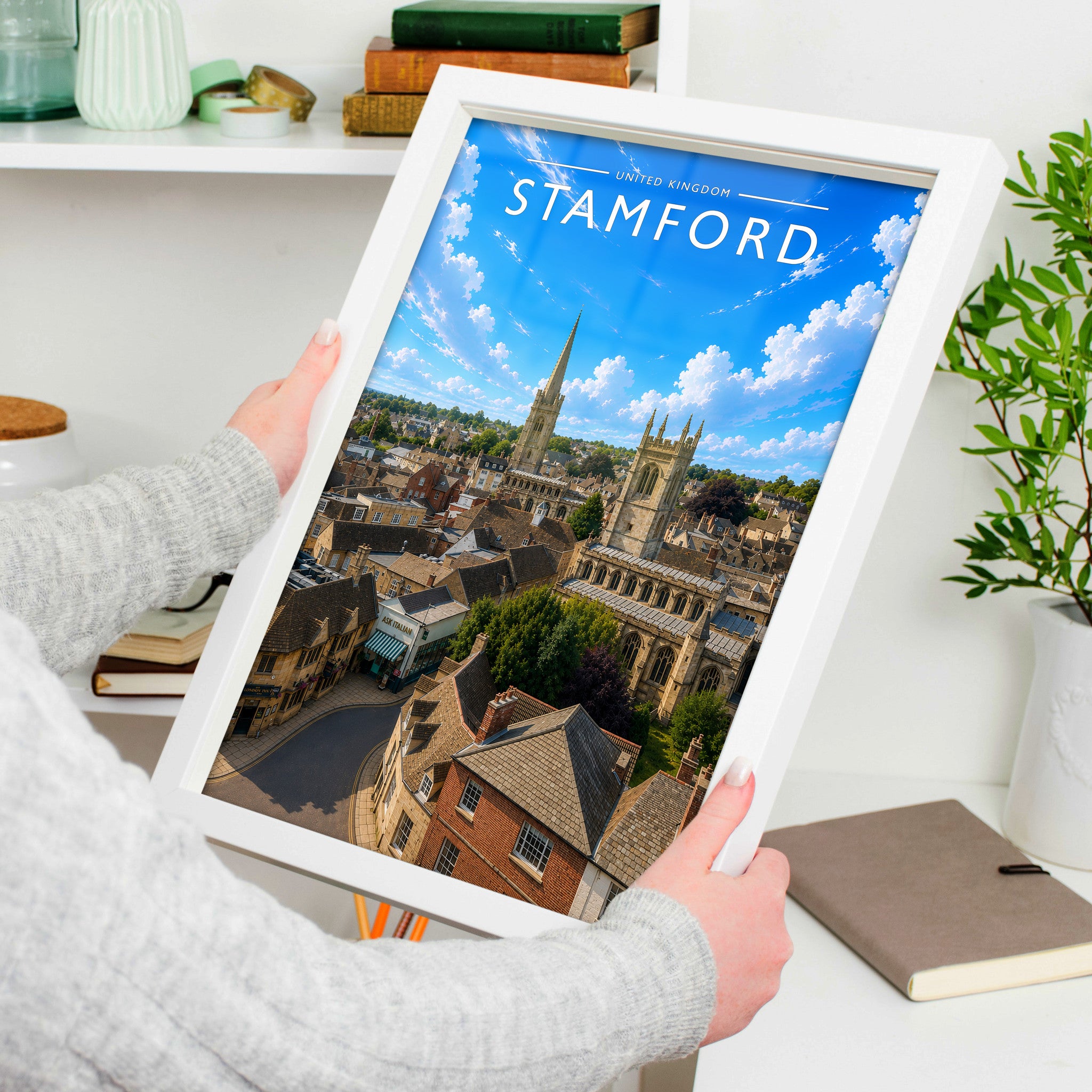 Stamford #12 Travel Poster in a white frame, held to show scale