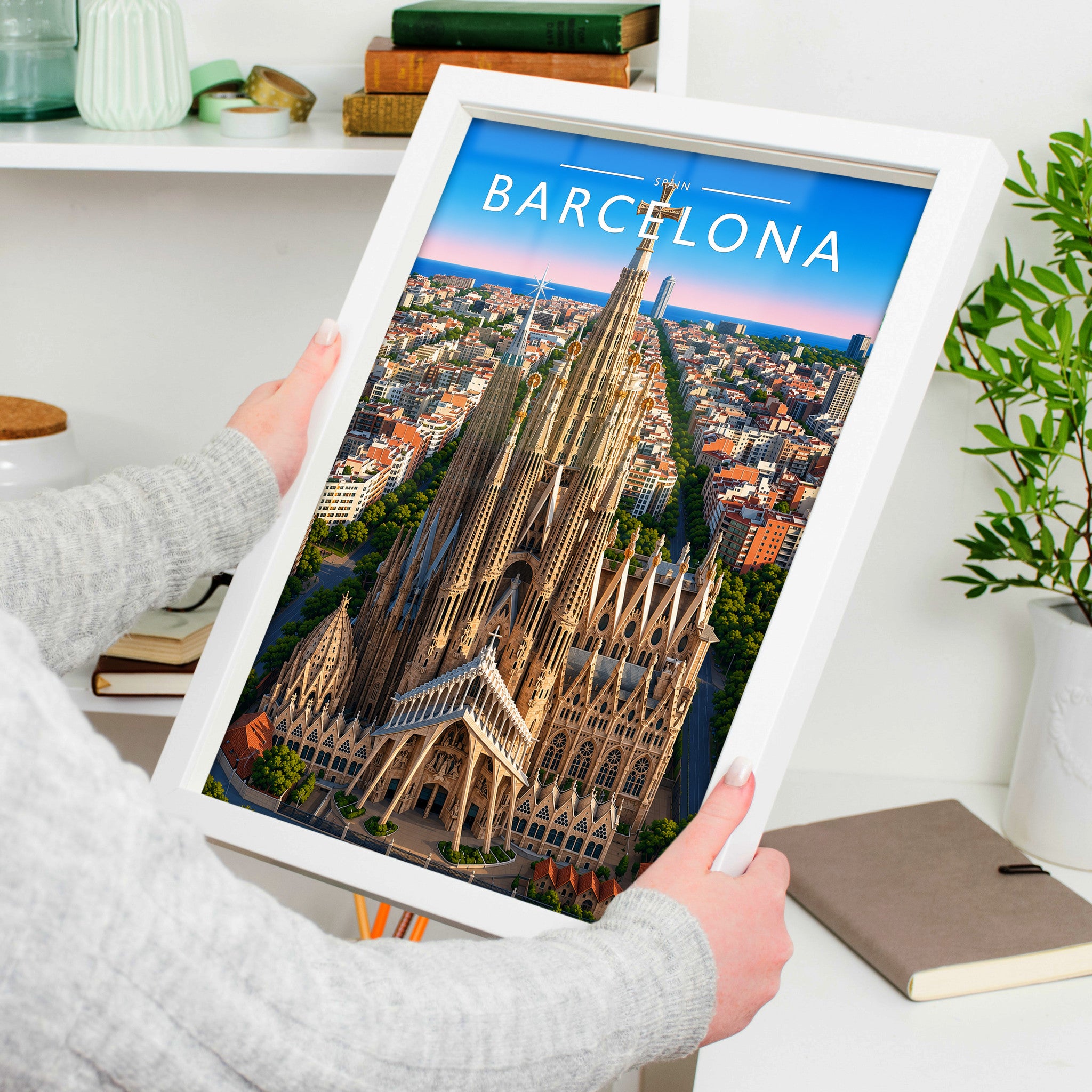 Barcelona Travel Poster in a white frame, held to show scale