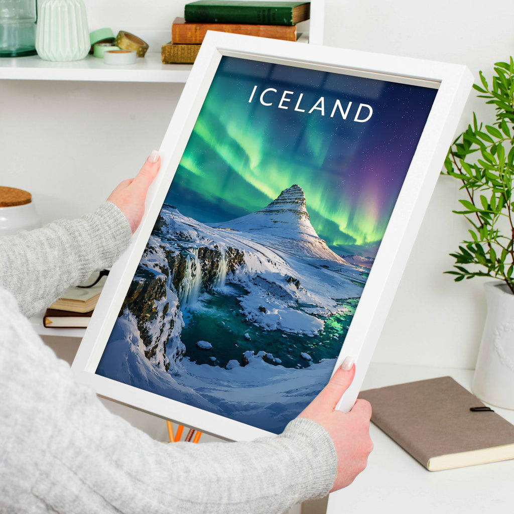 Iceland Travel Poster in a white frame, held to show scale