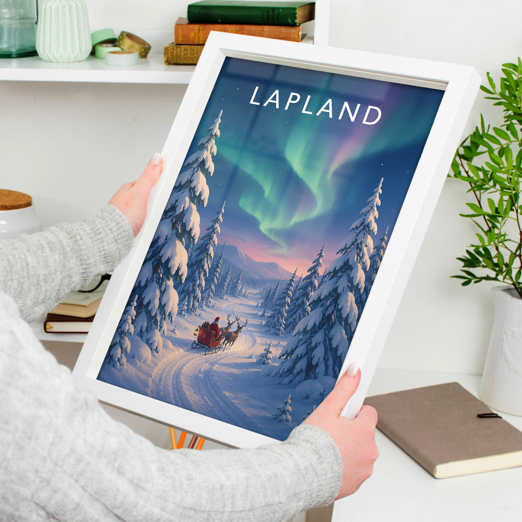 Lapland Travel Poster in a white frame, held to show scale