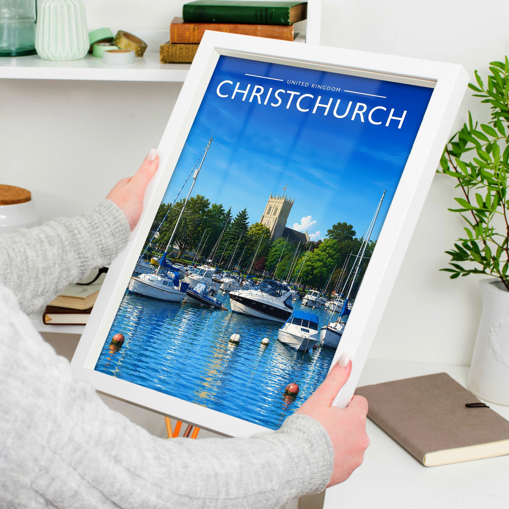 Christchurch Travel Poster in a white frame, held to show scale