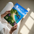 Durdle Door Travel Poster - A4 print held in hand
