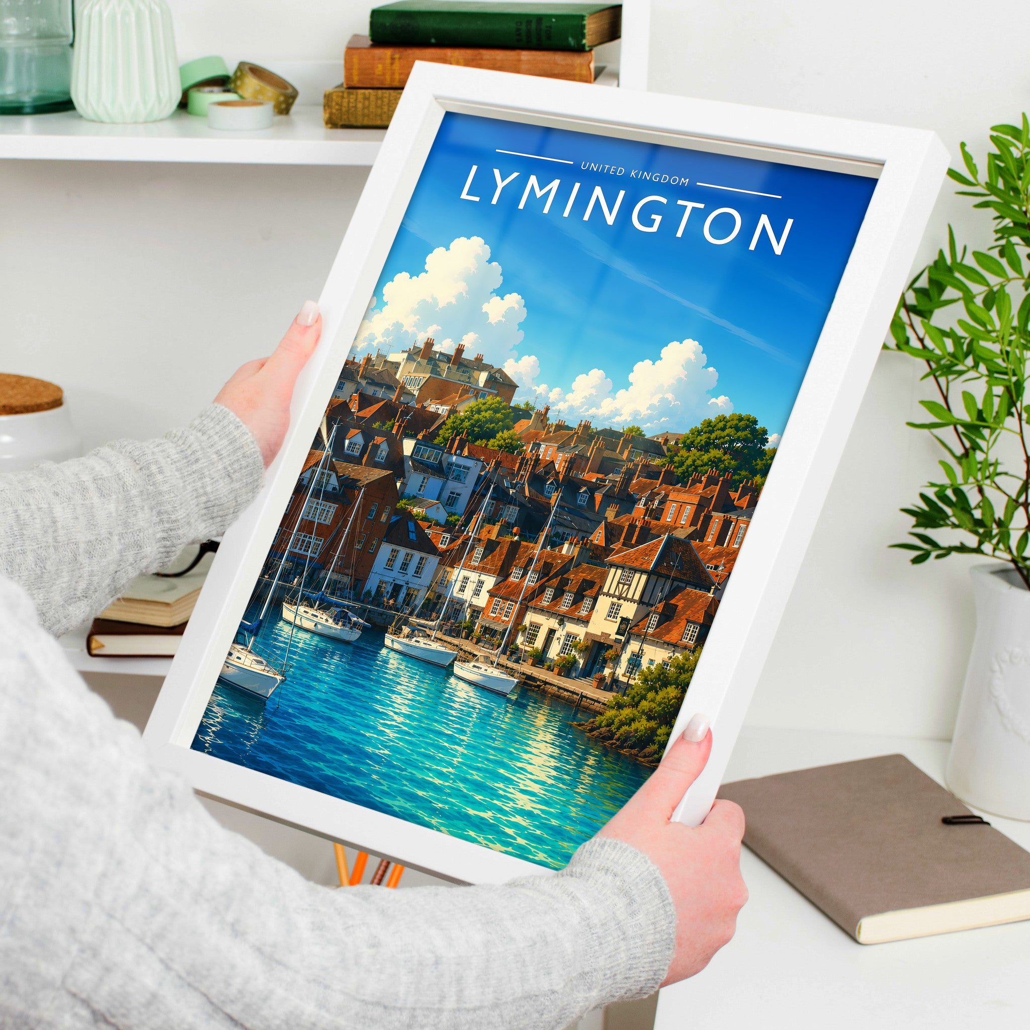 Lymington Travel Poster in a white frame, held to show scale