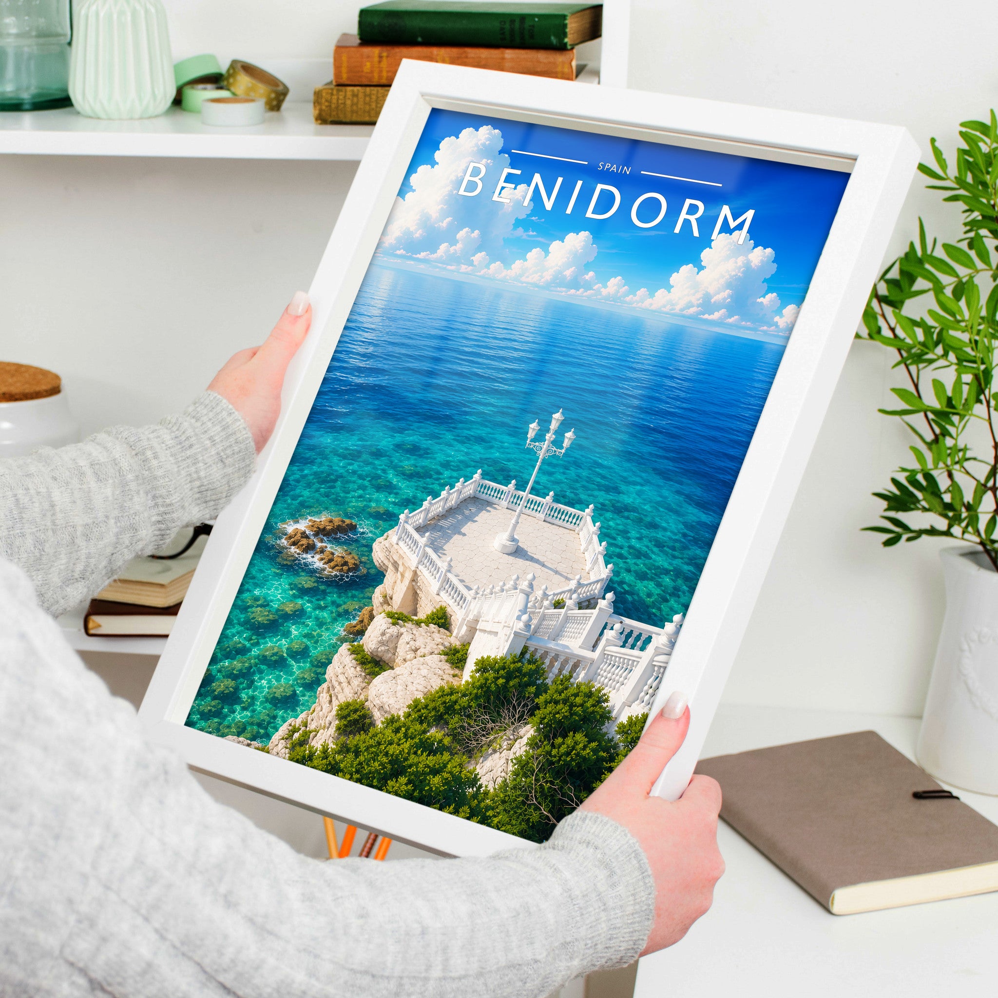 Benidorm #2 Travel Poster in a white frame, held to show scale