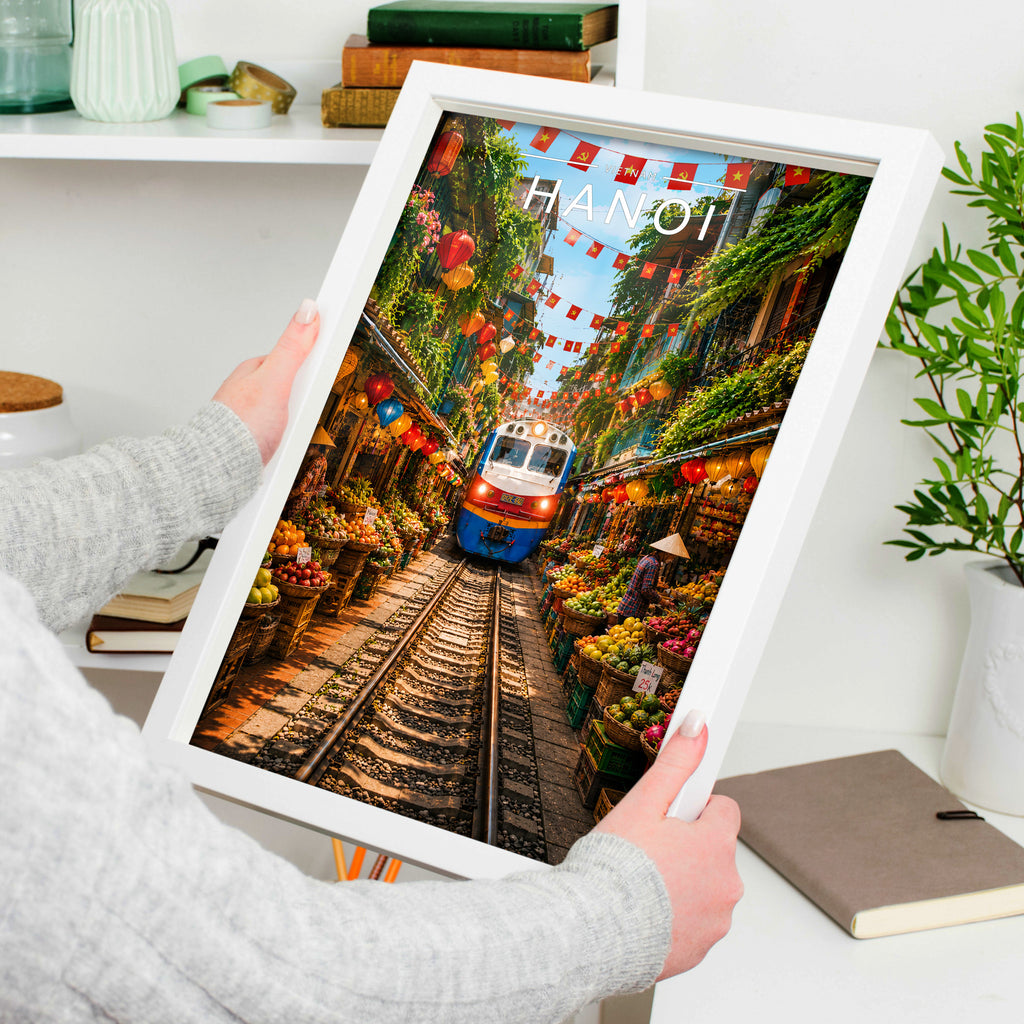 Hanoi Travel Poster in a white frame, held to show scale
