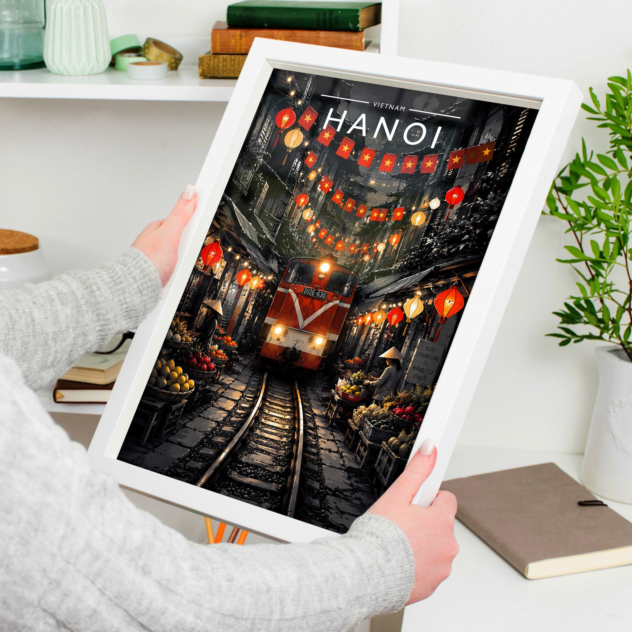 Hanoi #2 Travel Poster in a white frame, held to show scale