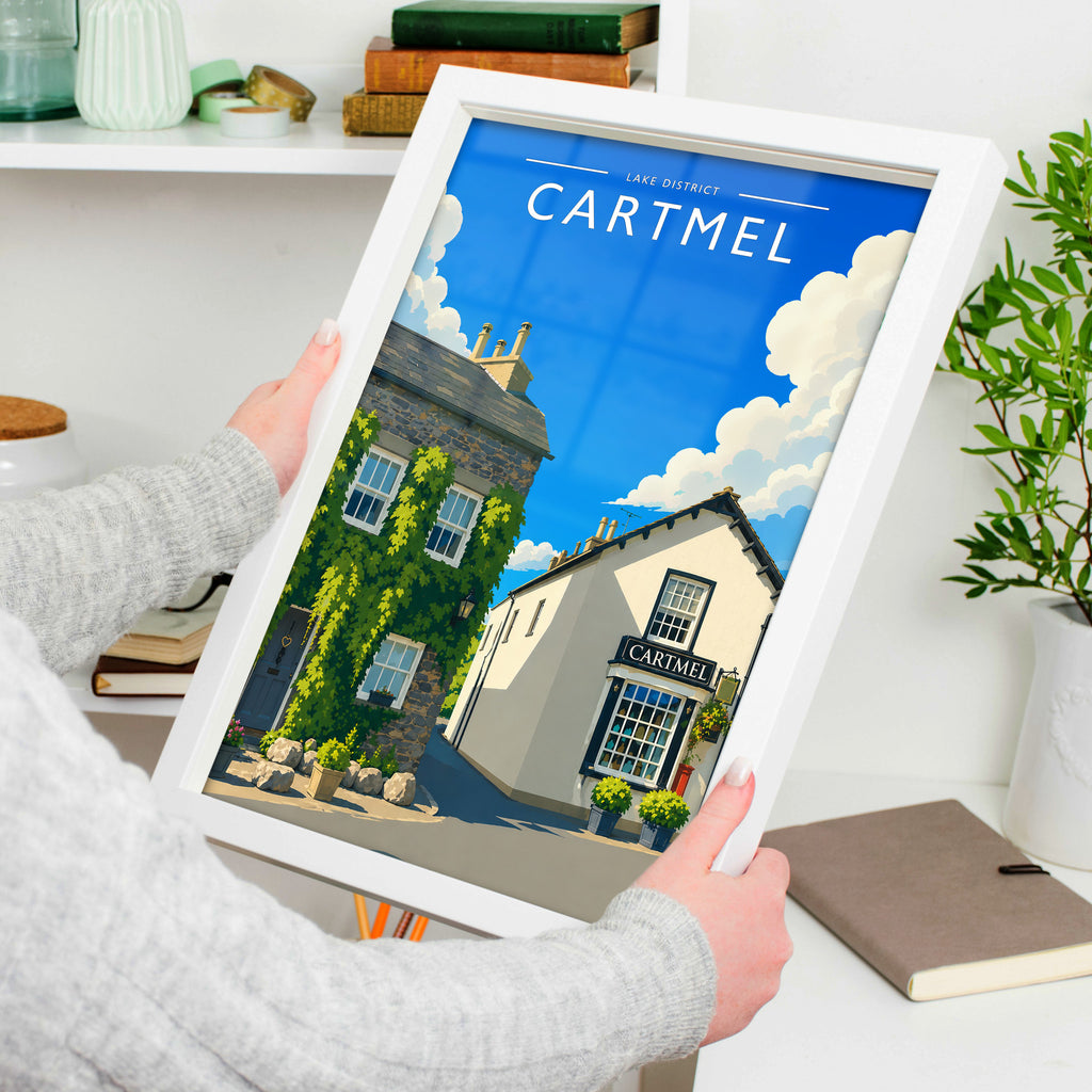 Cartmel #2 Travel Poster in a white frame, held to show scale