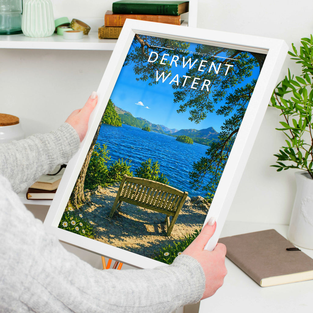 Derwent Water Travel Poster in a white frame, held to show scale