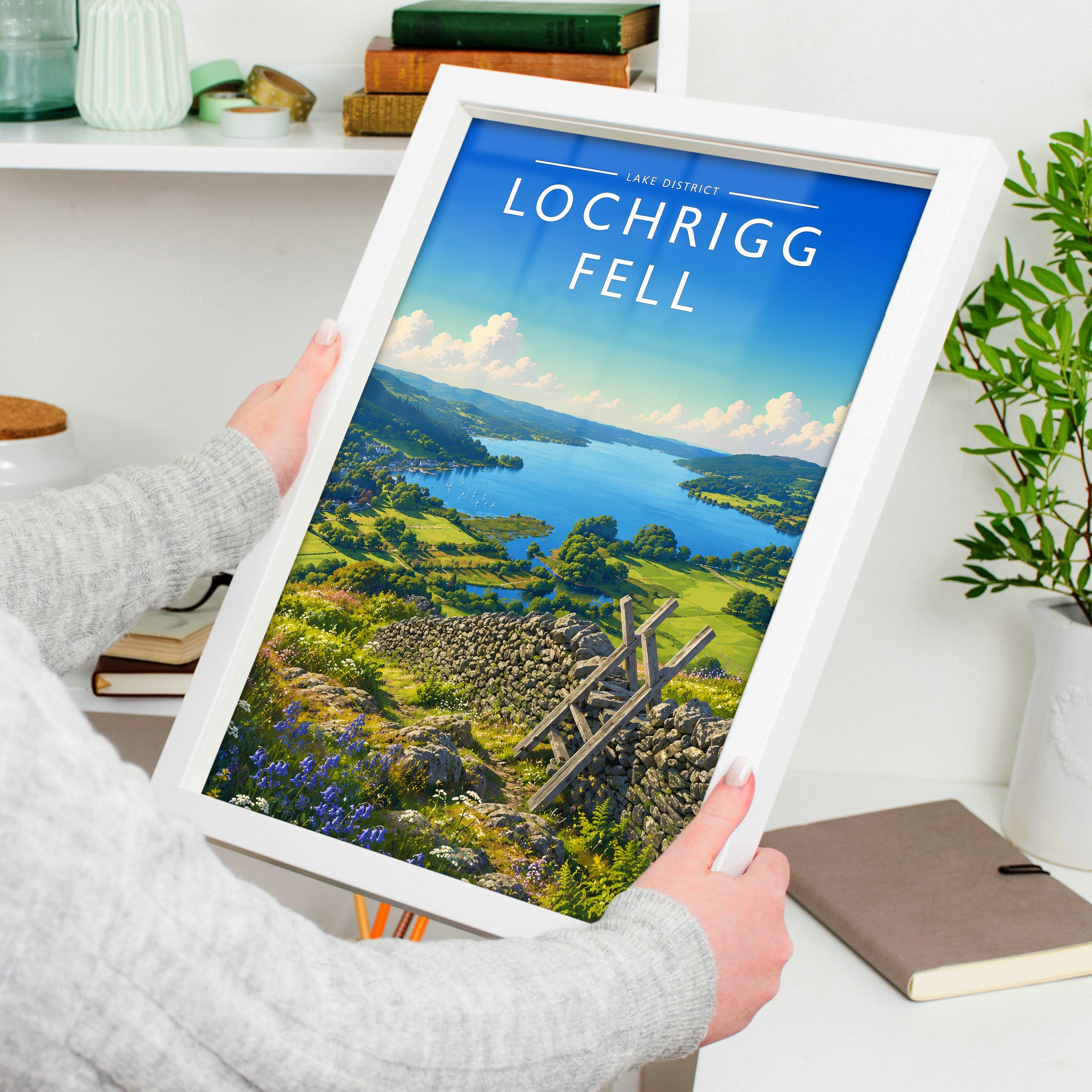 Loughrigg Fell #2 Travel Poster in a white frame, held to show scale
