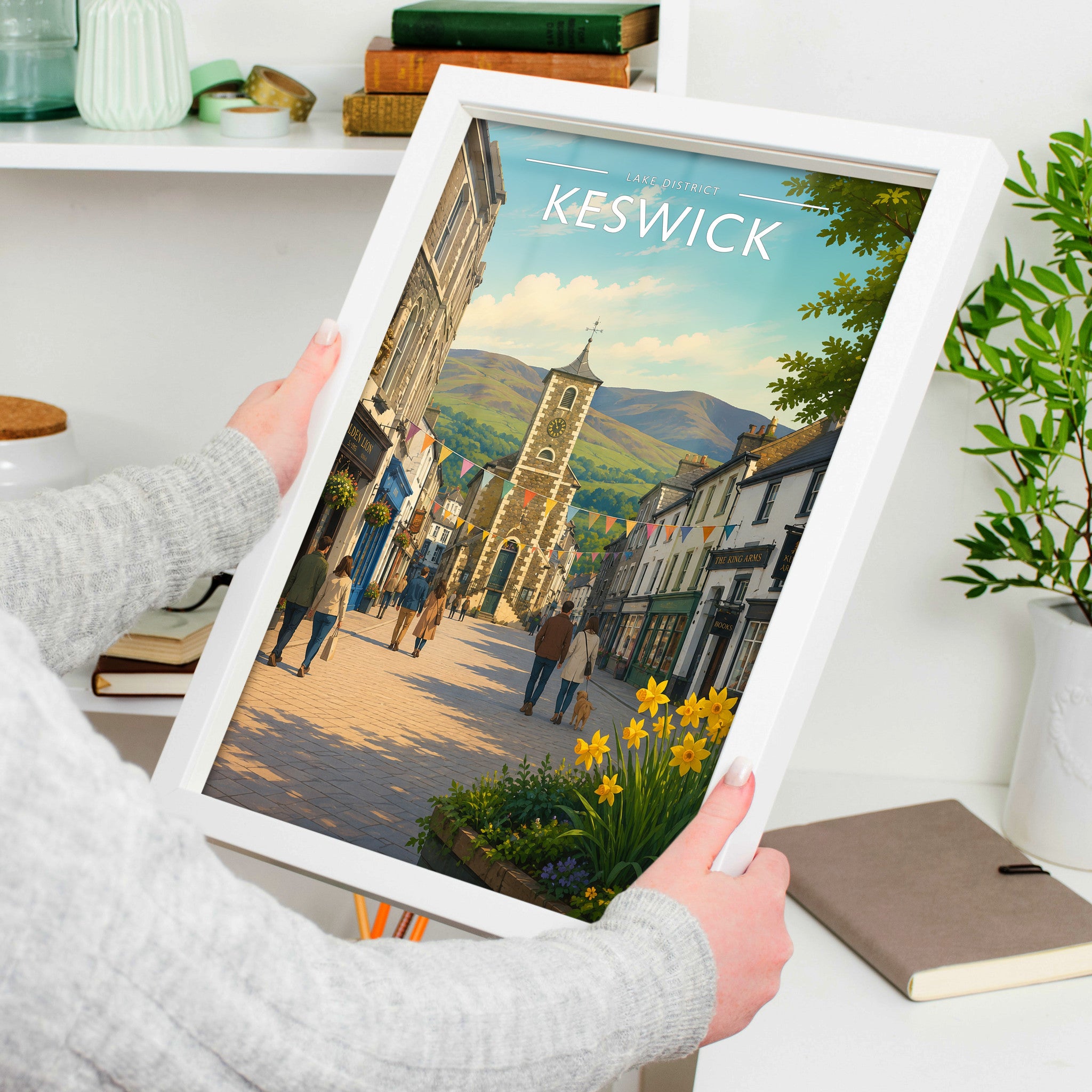 Keswick #2 Travel Poster in a white frame, held to show scale