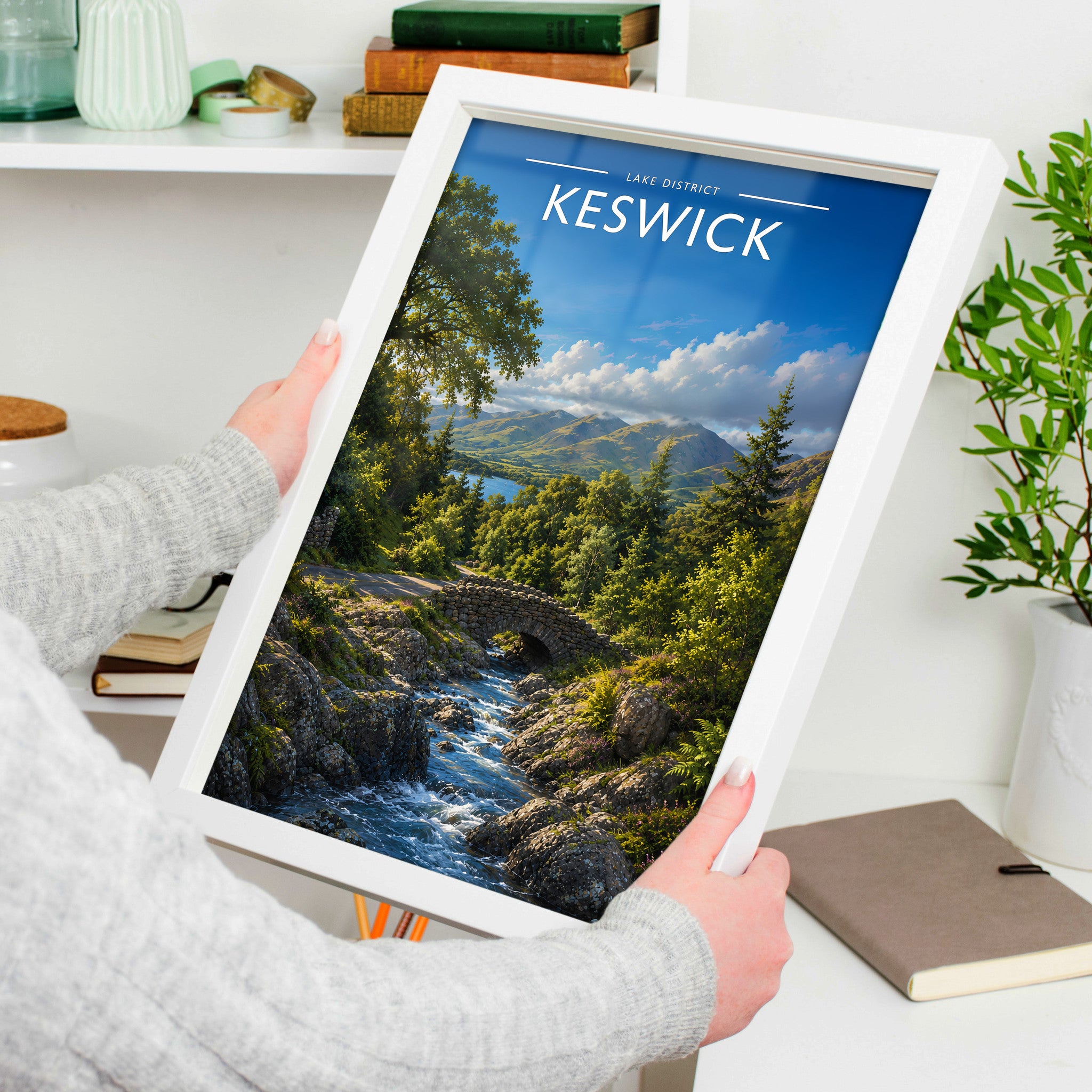 Keswick #3 Travel Poster in a white frame, held to show scale
