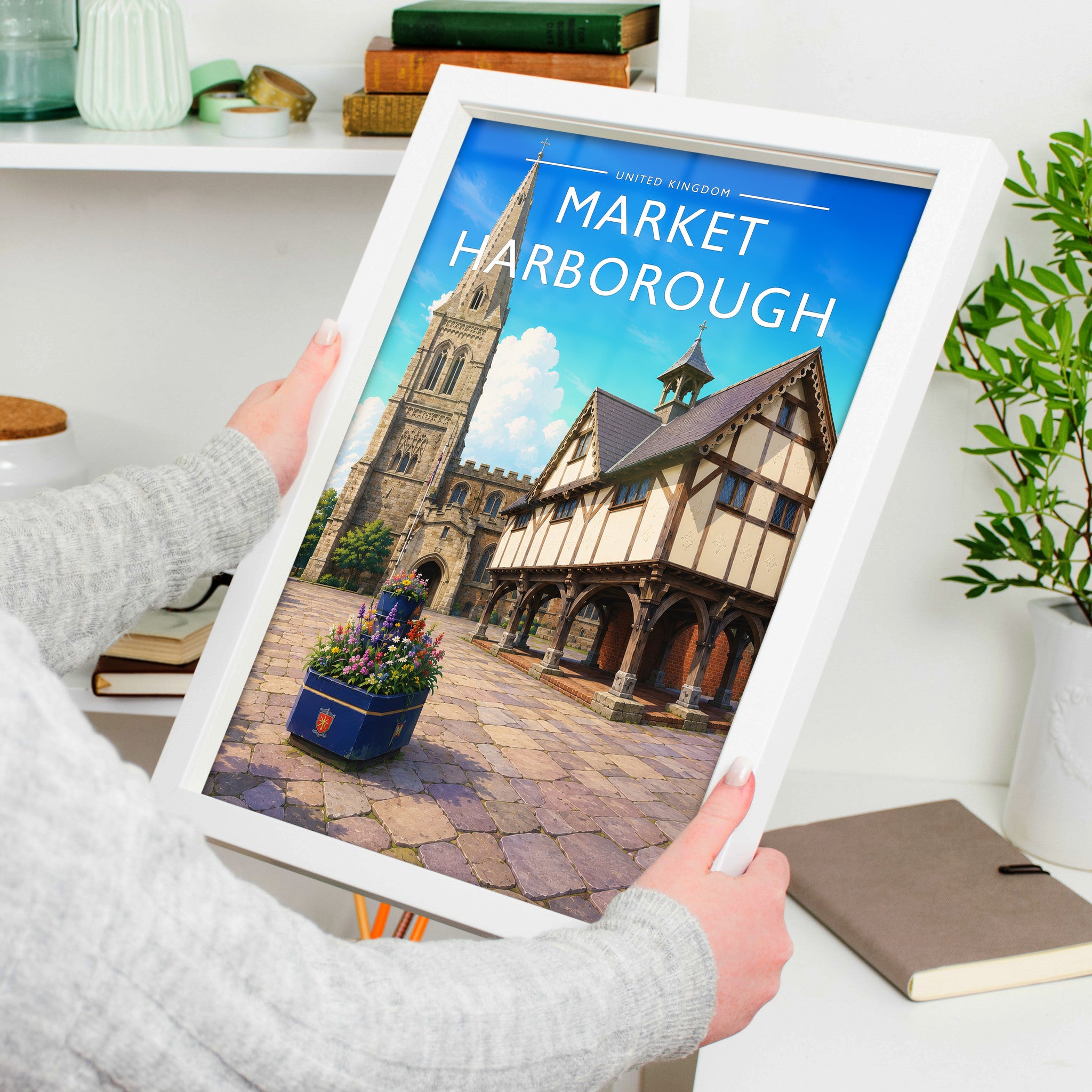 Market Harborough Travel Poster in a white frame, held to show scale
