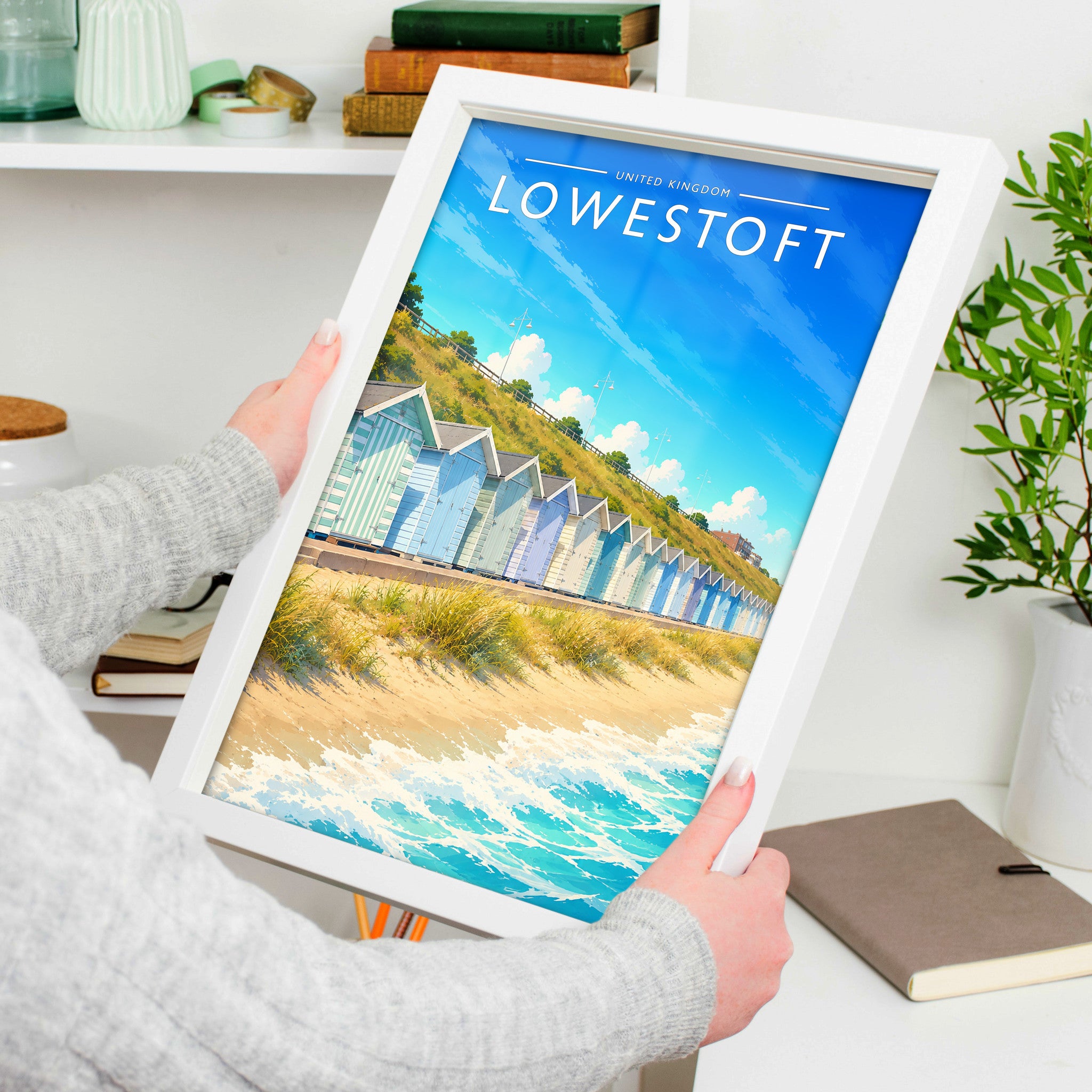 Lowestoft Travel Poster in a white frame, held to show scale