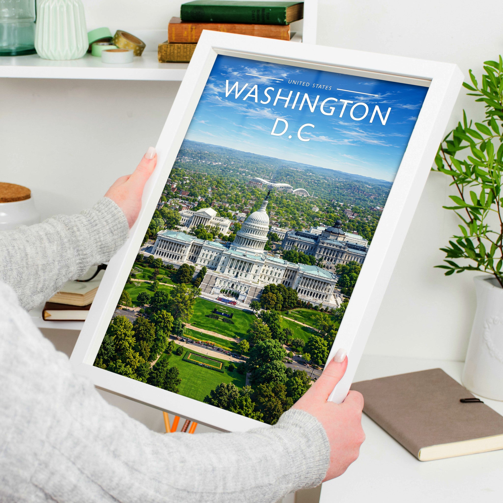 Washington D.C. Travel Poster in a white frame, held to show scale