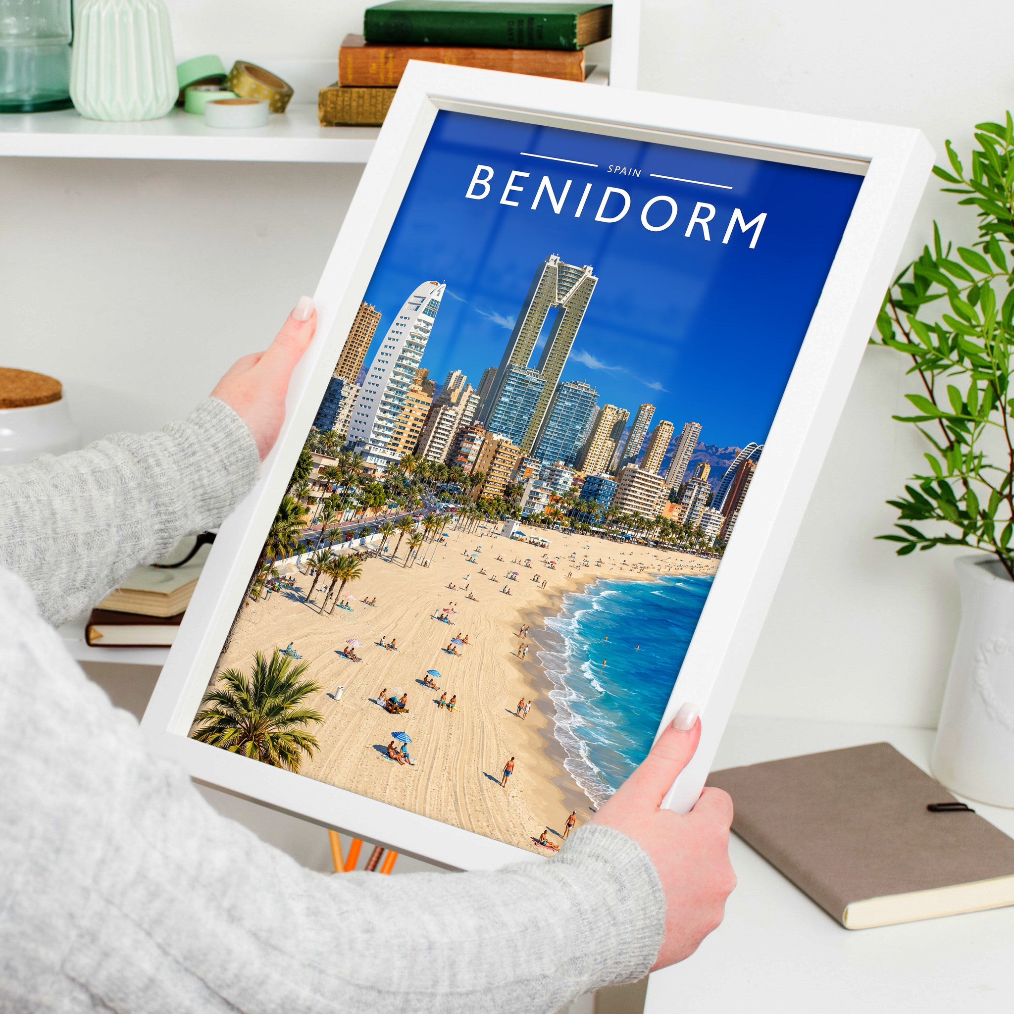 Benidorm #3 Travel Poster in a white frame, held to show scale
