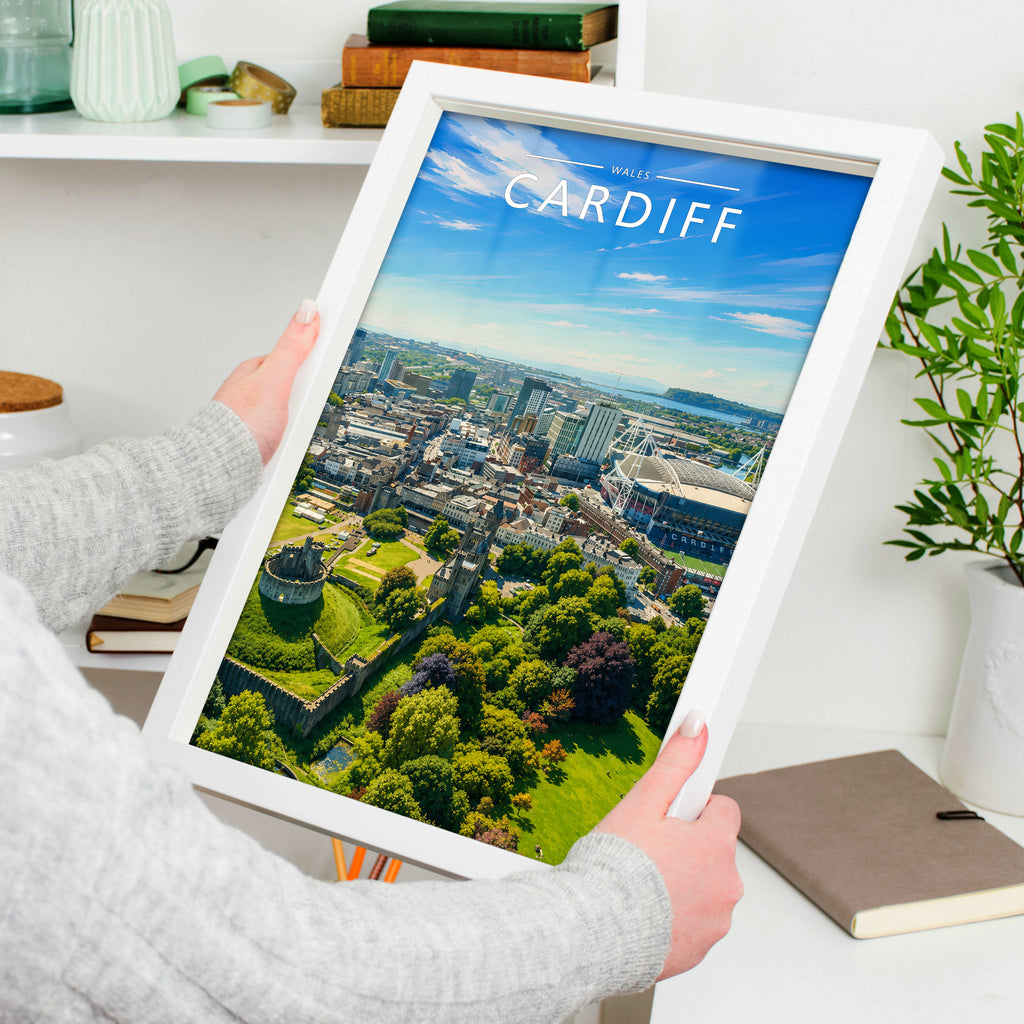 Cardiff #2 Travel Poster in a white frame, held to show scale
