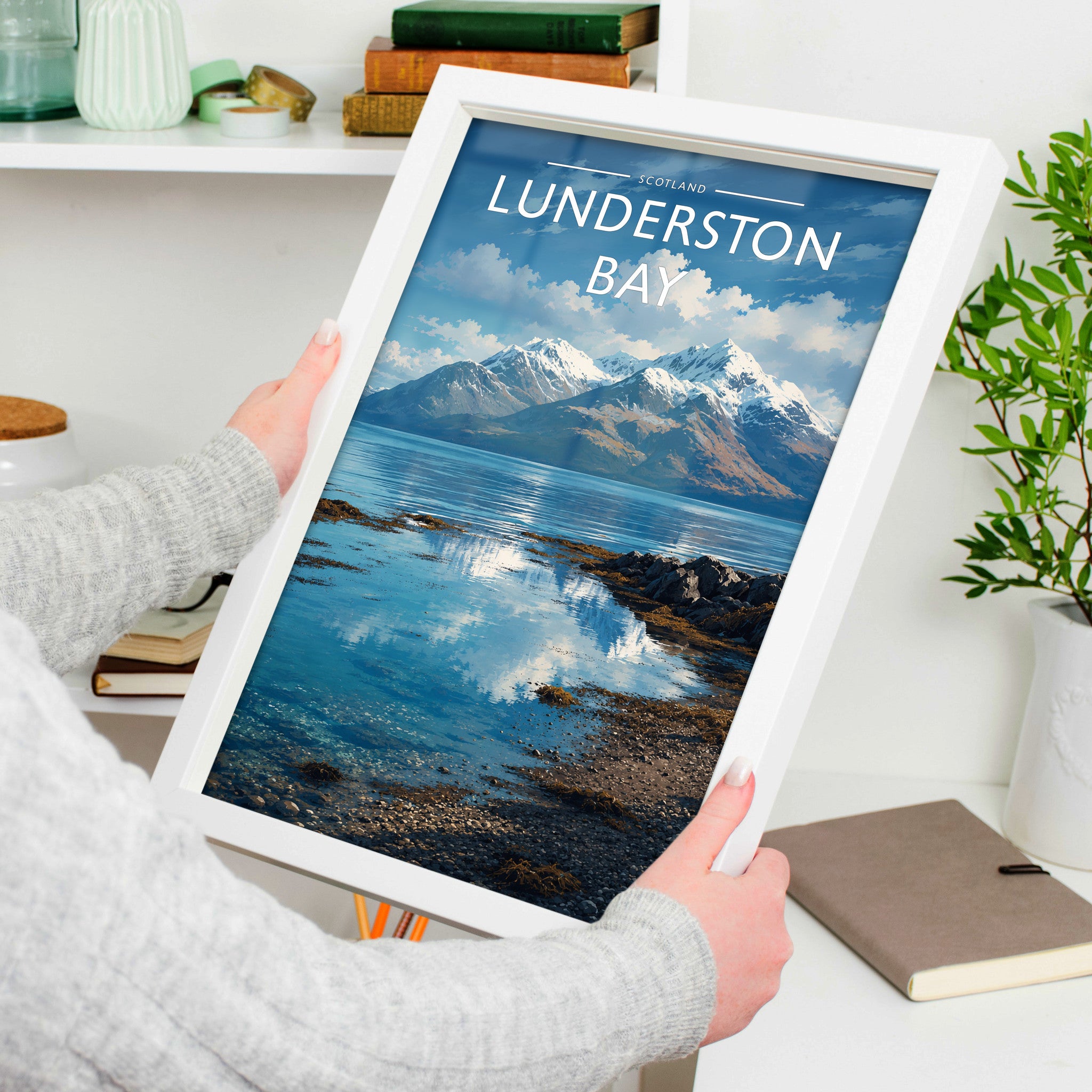 Lunderston Bay Travel Poster in a white frame, held to show scale