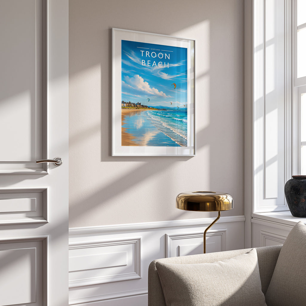 Troon Beach Travel Poster in a white frame on a panelled wall
