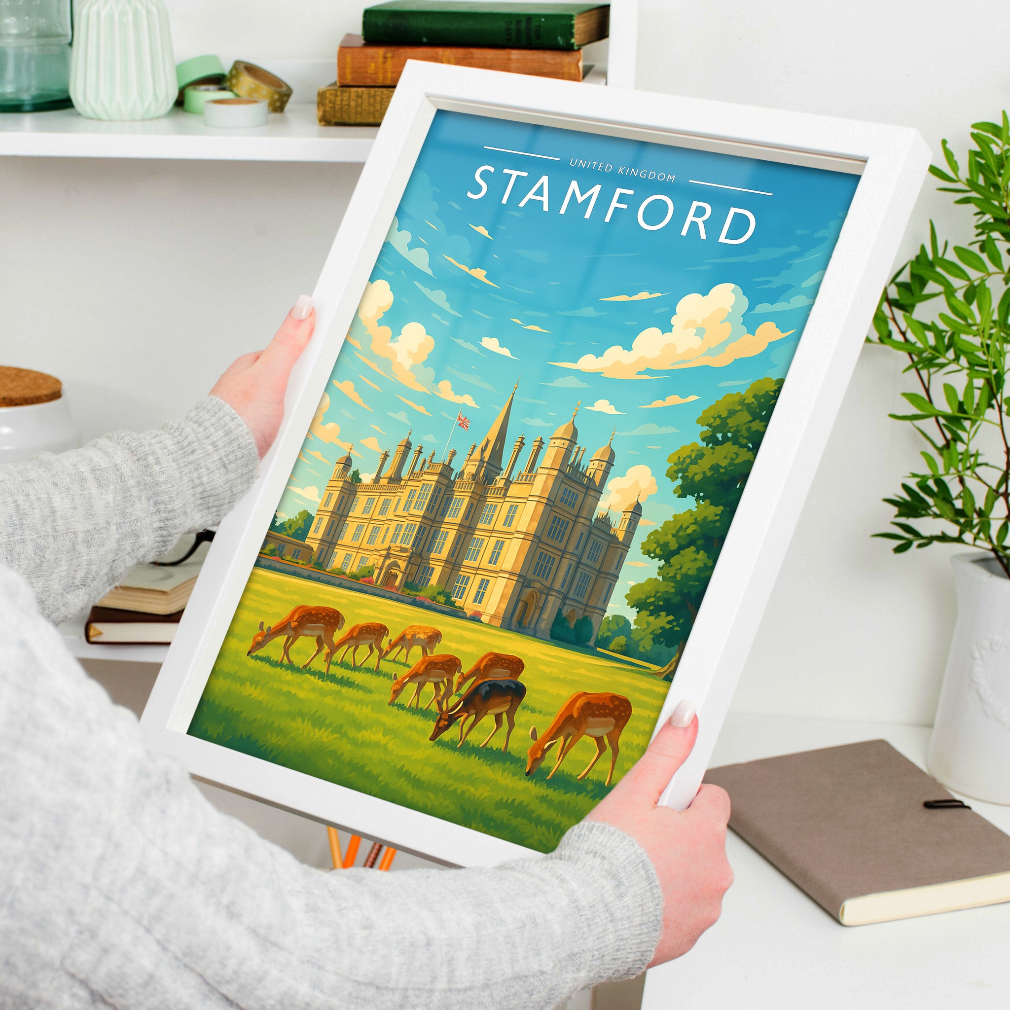 Stamford #2 Travel Poster in a white frame, held to show scale