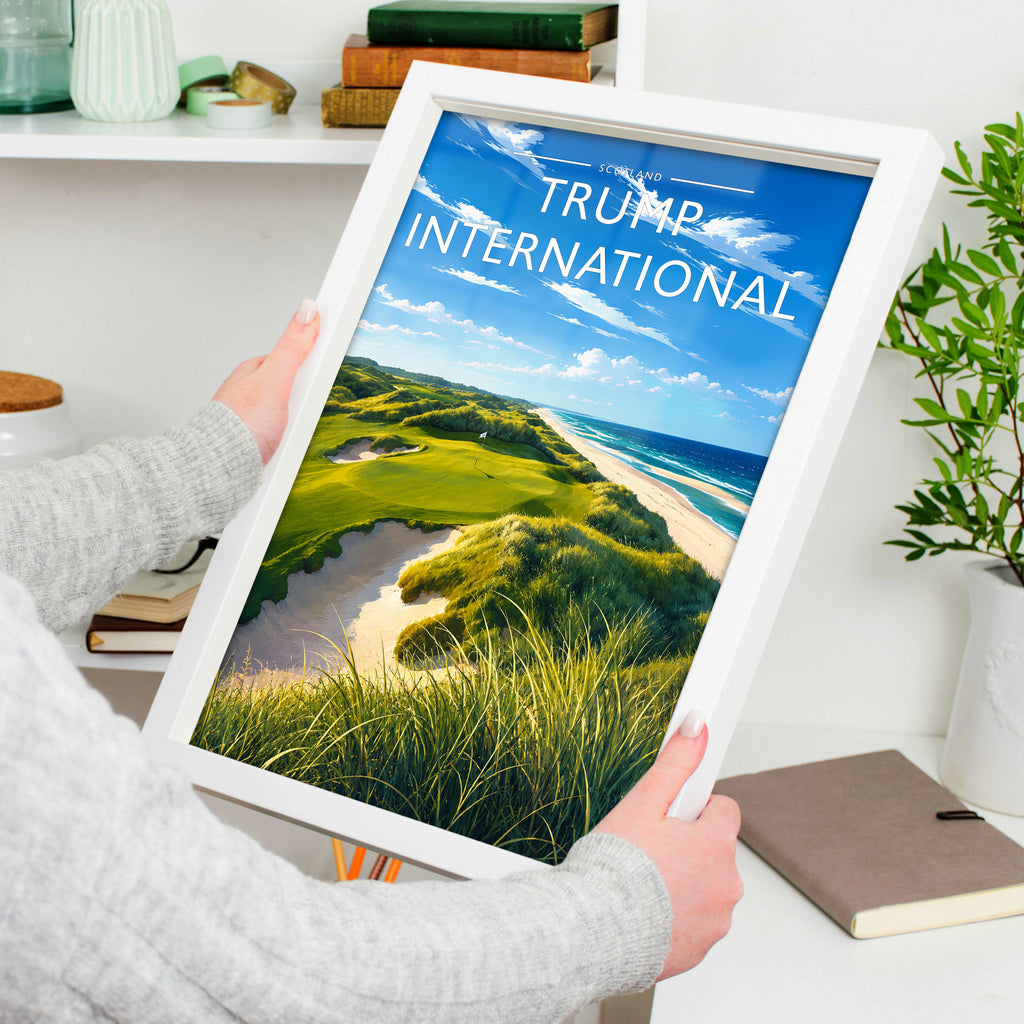 Trump International Travel Poster in a white frame, held to show scale