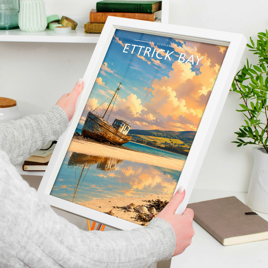Ettrick Bay Travel Poster in a white frame, held to show scale