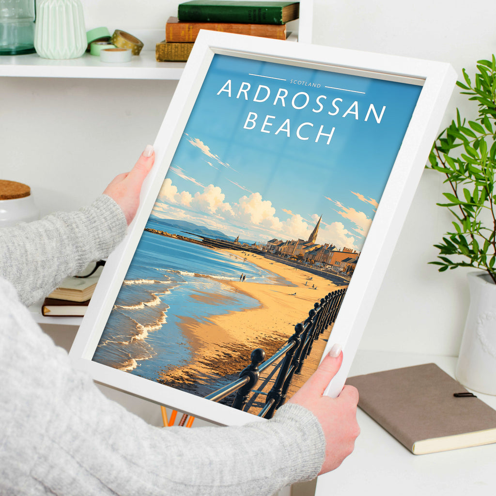 Ardrossan Beach Travel Poster in a white frame, held to show scale