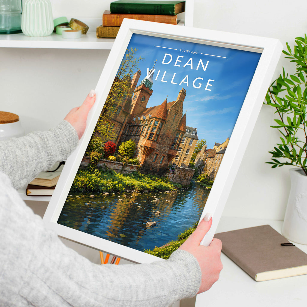 Dean Village Travel Poster in a white frame, held to show scale