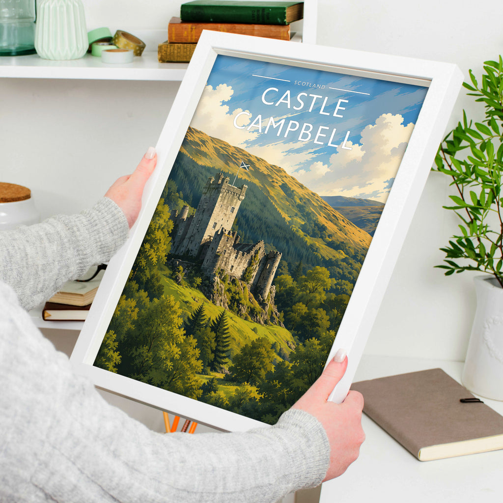 Castle Campbell Travel Poster in a white frame, held to show scale