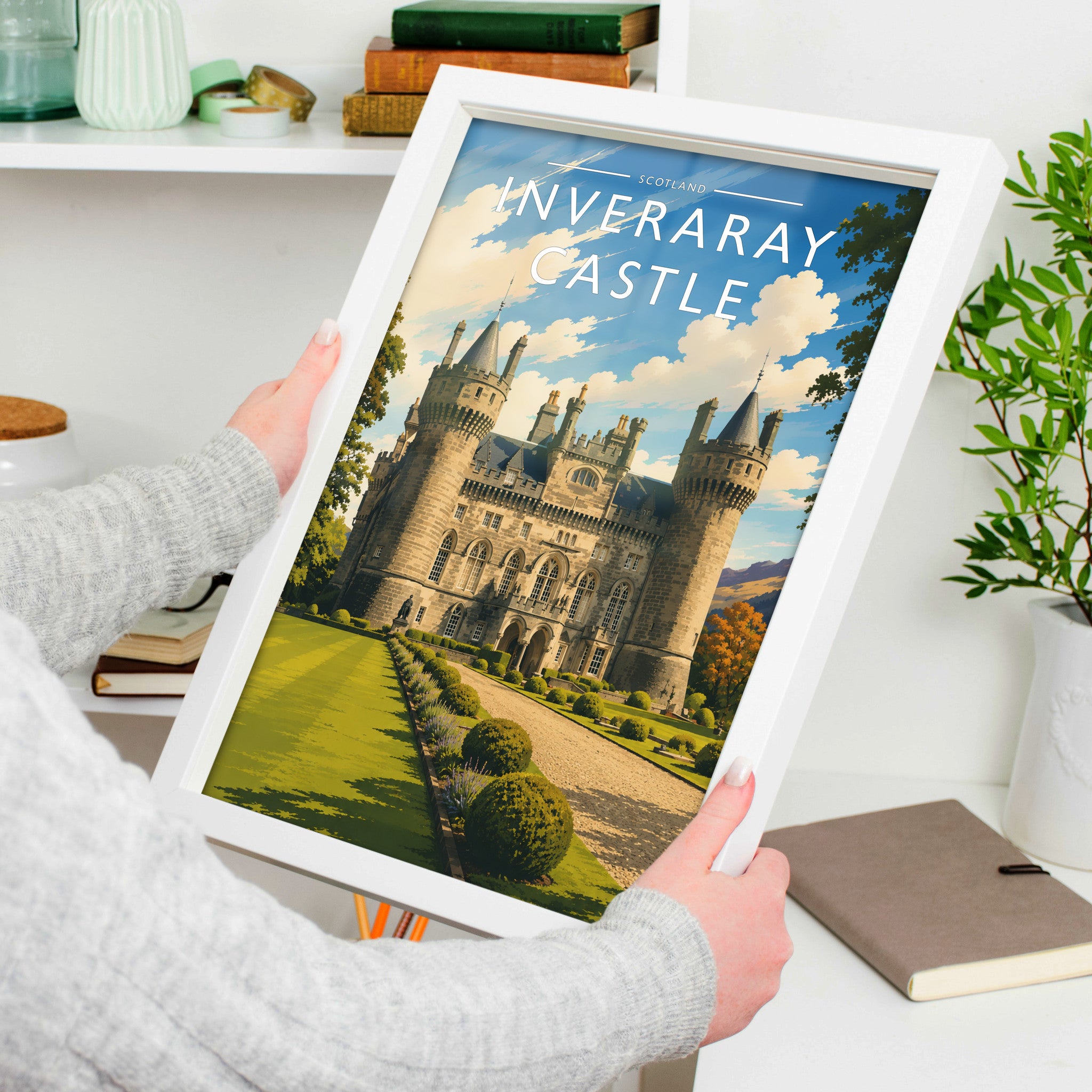 Inveraray Castle Travel Poster in a white frame, held to show scale