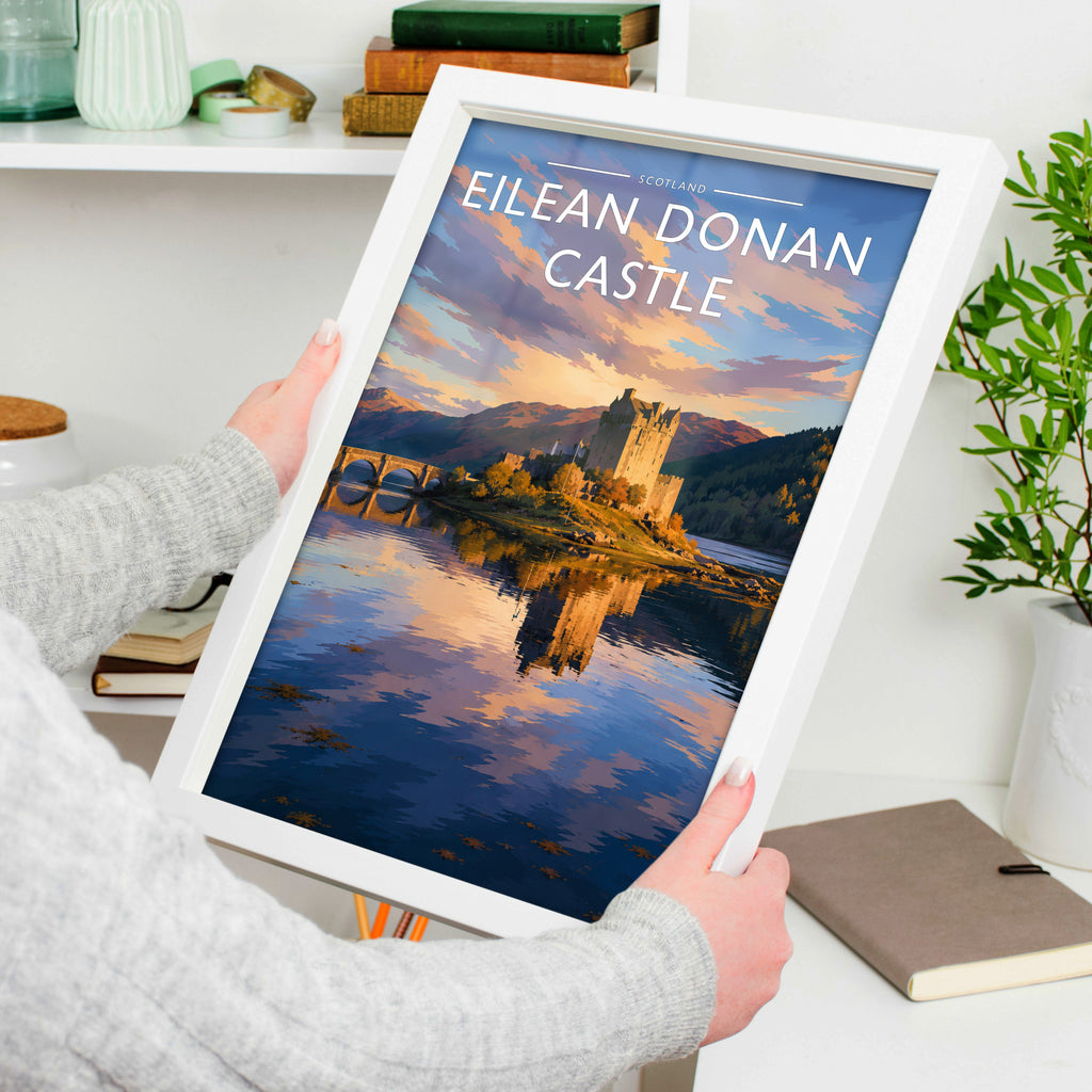 Eilean Donan Castle #2 Travel Poster in a white frame, held to show scale