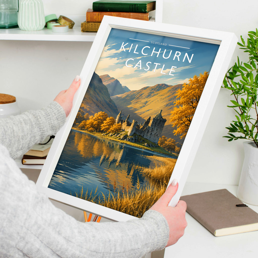 Kilchurn Castle Travel Poster in a white frame, held to show scale