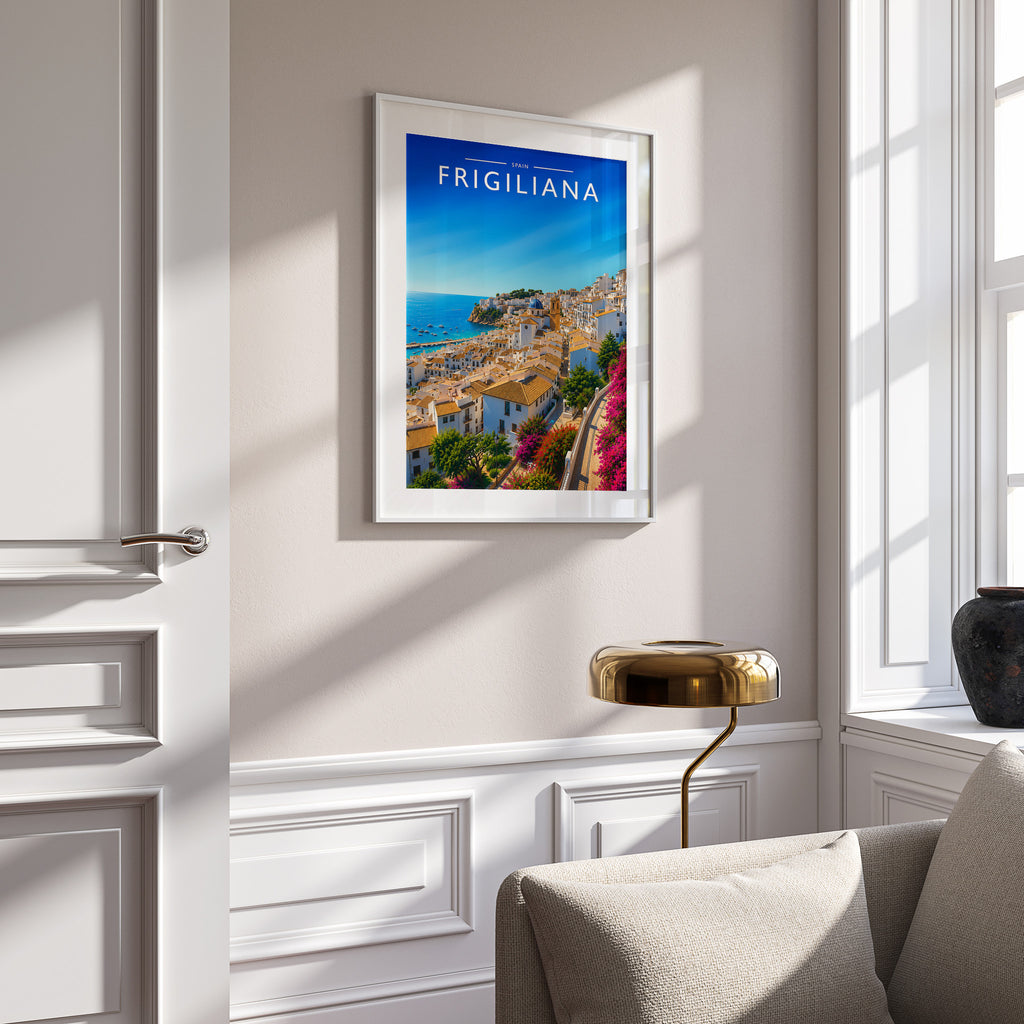 Frigiliana Travel Poster in a white frame on a panelled wall