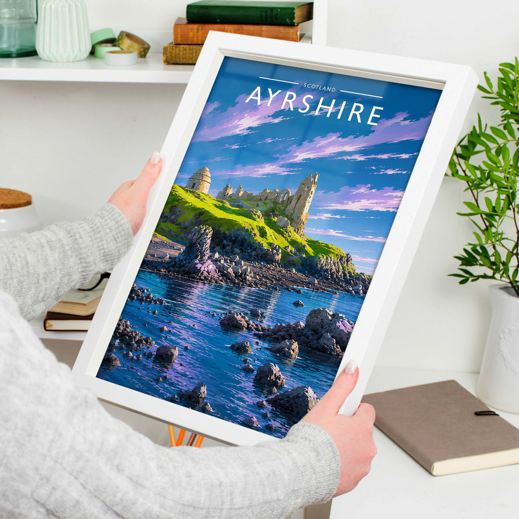 Ayrshire Travel Poster in a white frame, held to show scale