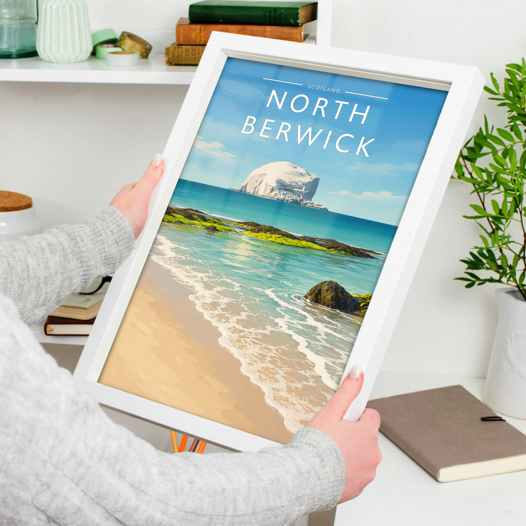 North Berwick Travel Poster in a white frame, held to show scale