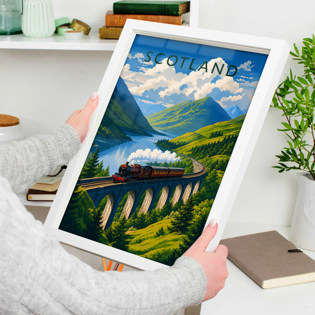 Scotland Travel Poster in a white frame, held to show scale
