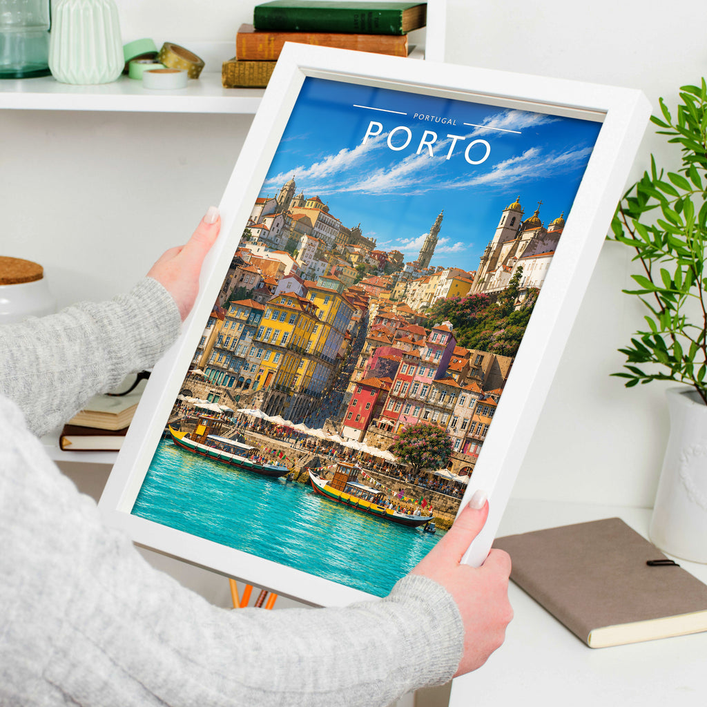 Porto #2 Travel Poster in a white frame, held to show scale